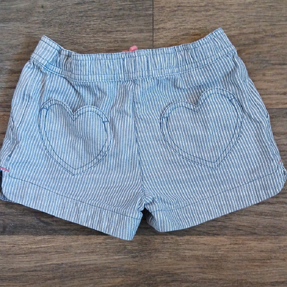 Boden Girl's Seersucker Striped Heart Pocket Shorts.